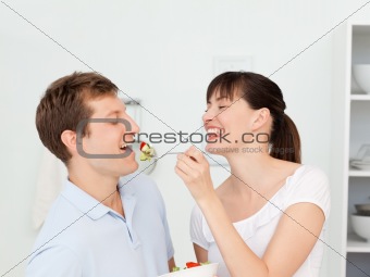 Happy couple eating together 