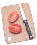 Sliced Roma Tomato on a Wooden Chopping Block