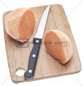 Sliced Sweet Potatoes on a Wooden Chopping Block