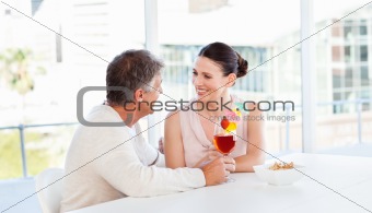 Happy couple drinking a glass 