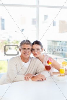 Happy couple drinking a glass 