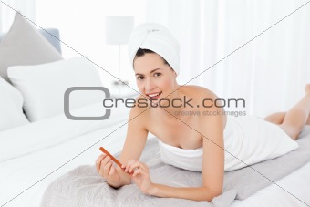 Superb woman filing her nails