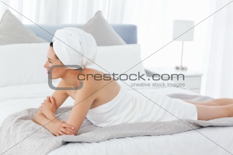 Beautiful women lying down on a bed
