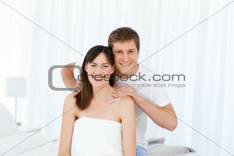 Man giving massage to his wife