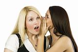 Two women whispering secrets
