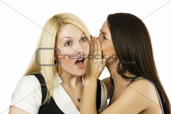 Two women whispering secrets