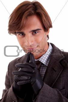 Portrait of a happy young businessman, in autumn/winter clothes, isolated on white. Studio shot