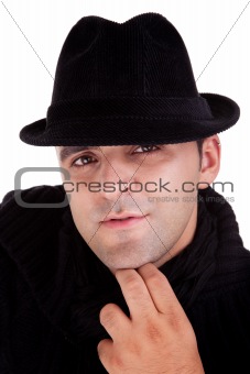 Portrait of a man with his black hat, isolated on white. Studio shot