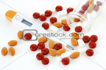 Thermometer and colorful pills