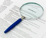 contract with a magnifying glass