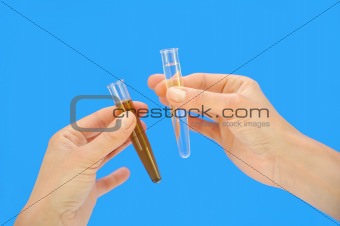 Clean and dirty water samples in hands