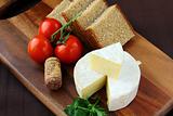 delicatessen soft cheese with bread, tomatoes