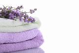 Stack of terry towels with lavender flowers 