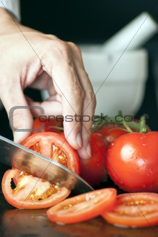 Chef Slicing Tomatoes
