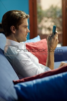 man typing sms on cellphone