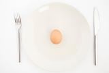 one egg on white plate