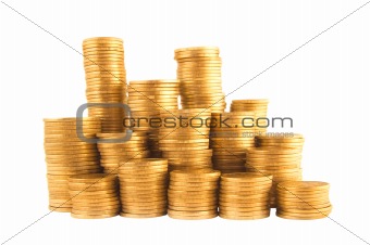 Many golden coins in columns isolated on white background