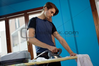 man with iron doing chores