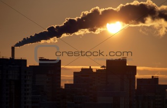 Smoke and sun on city