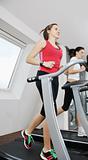woman workout  in fitness club on running track 