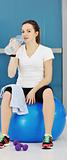 woman drinking water at fitness workout