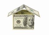 House built with Dollar money bills isolated on white background
