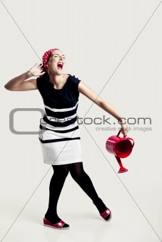 Portrait of a beautiful fashion woman posing and holding a red w