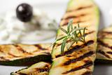 grilled zucchini with a rosemary leaf