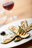 grilled zucchini with a rosemary leaf