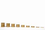 Columns of golden coins arranged in staircase shape,