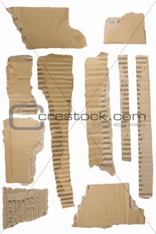 Pieces of torn brown corrugated cardboard