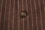 classic striped fabric with close-up of brown button 
