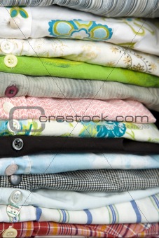 stack of colored shirt, details of buttons