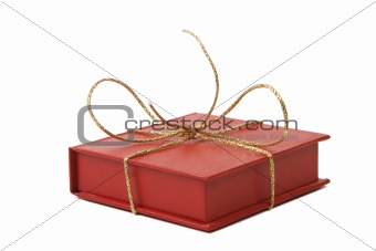 red present box with golden shiny ribbon