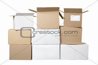 Brown and white different cardboard boxes arranged in stack
