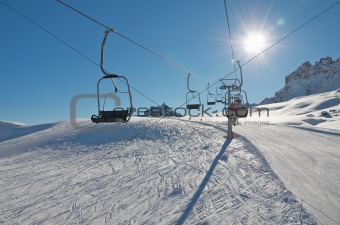 Chair ski lift over snow
