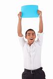 happy young latino man, raised arms with blue card in hand, isolated on white background. Studio shot.