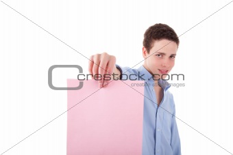 young smiling man holding a pink sheet of paper in his hand; isolated on the white background. Studio shot.