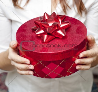 red box holding in hand of young girl