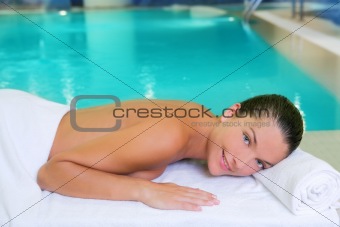 spa pool woman relaxed on white towel