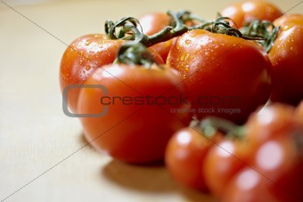 ripe of tomatoes on kitchen table