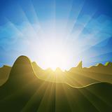 Sunburst rays over mountain tops