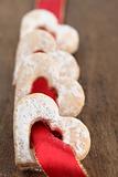 Red ribbon with shortbread hearts