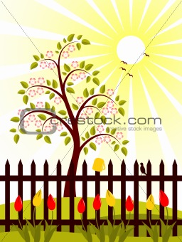 flowering tree behind fence