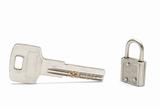 Big key and a small padlock isolated on white
