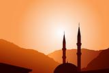 Vector mosque silhouette at sunset 