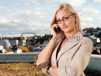 Beautiful businesswoman talking on cellphone