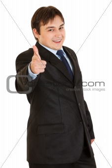 Smiling elegant businessman pointing finger at you
