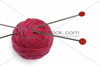 Red clew and knitting needles
