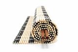 Rolled bamboo mat with chopsticks isolated on white
